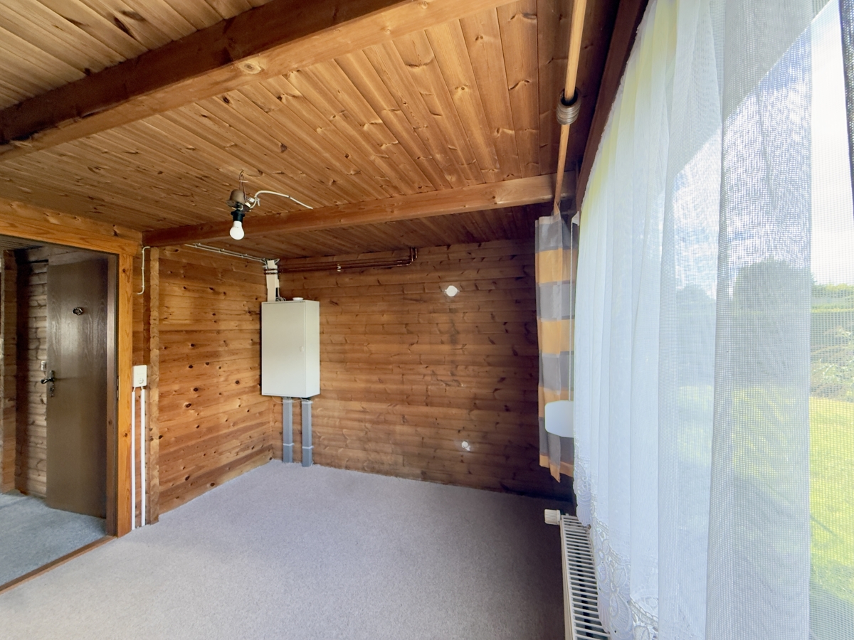 RESERVIERT | Provisionsfreies Blockbohlenhaus mit Garage auf über 1.000qm im Blumenhag