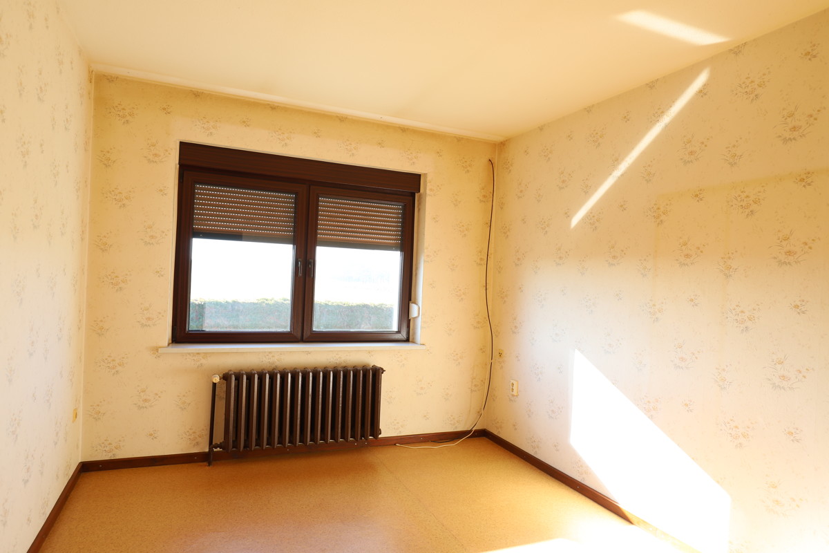 RESERVIERT | Solides Einfamilienhaus mit Ausbaureserve, Vollkeller und Feldblick.